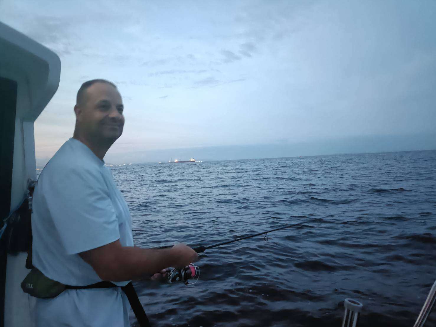Mr. Jim casting aboard BLEU LANE on Tokyo Bay before sunrise