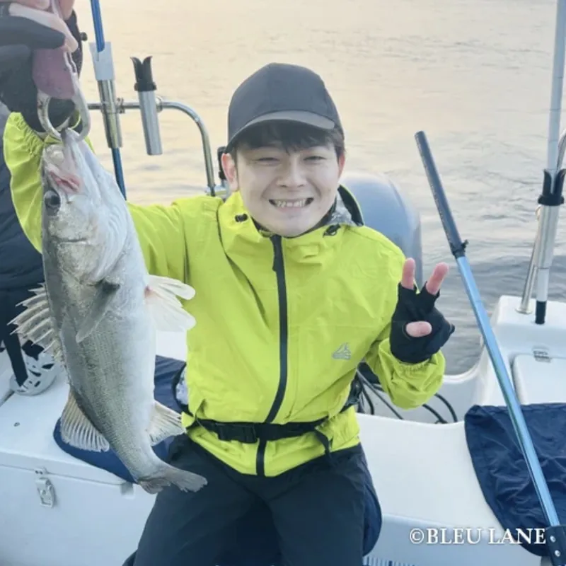 Smiling guest showing a catch
