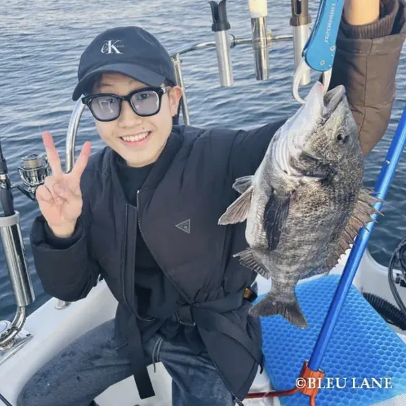 Guest celebrating a successful catch