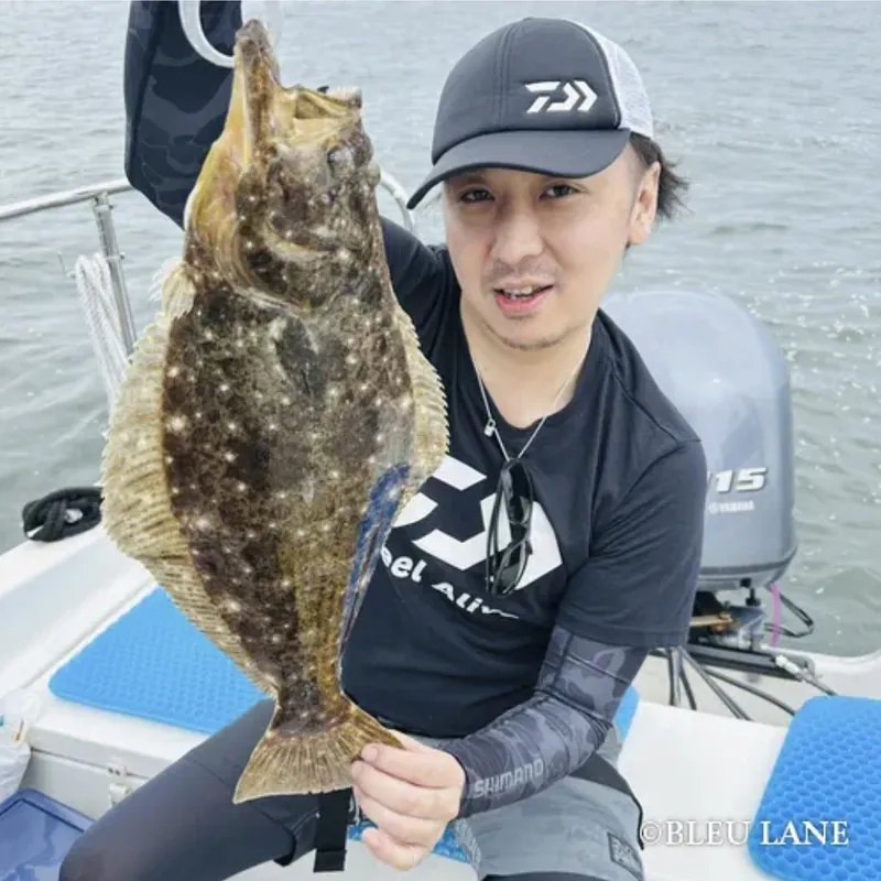 Guest holding a flatfish on Tokyo Bay