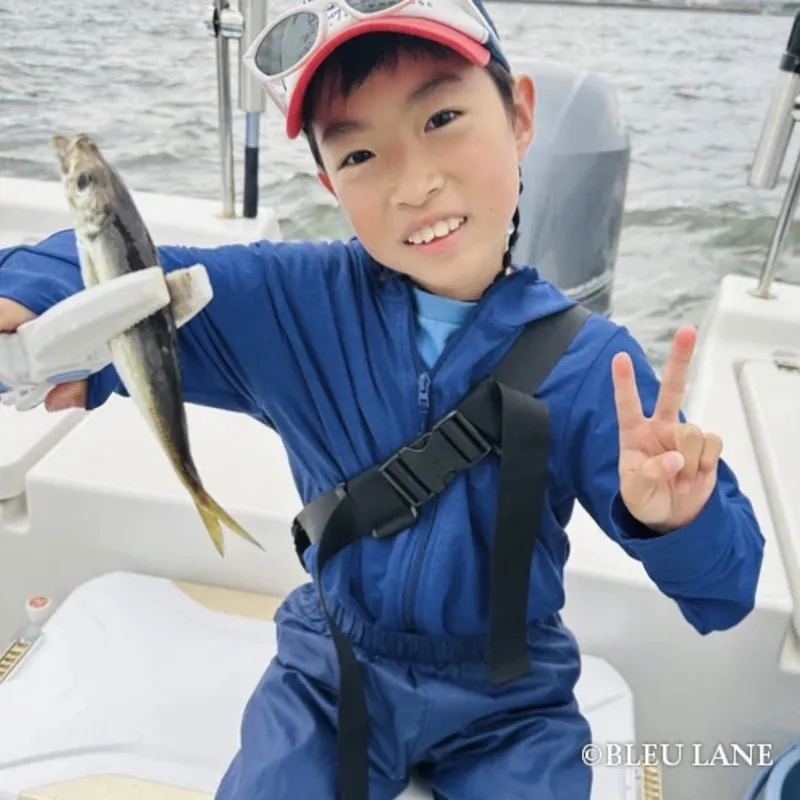 Young guest smiling with a catch