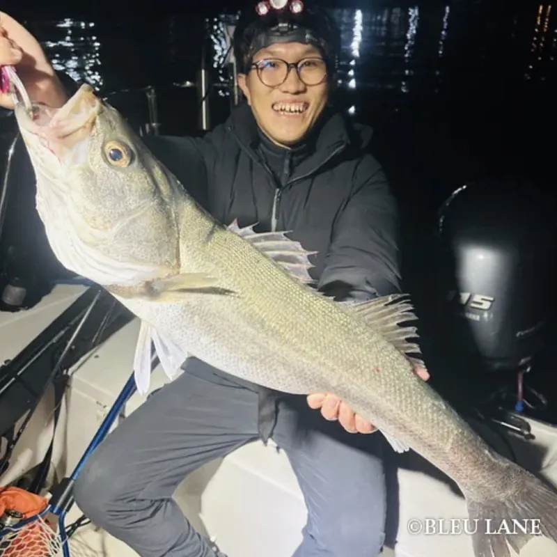 Guest celebrating a night fishing catch